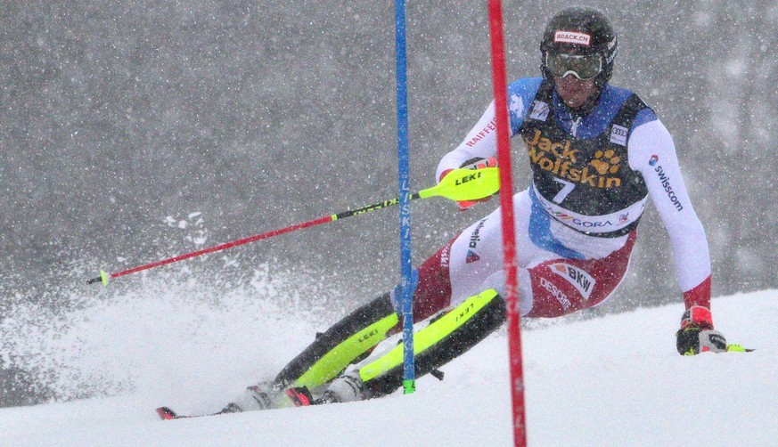 epa09073345 Ramon Zenhaeusern of Switzerland clears a gate during the first run of the Men&#039;s Slalom race at the FIS Alpine Skiing World Cup in Kranjska Gora, Slovenia, 14 March 2021. EPA/IGOR KUP ...