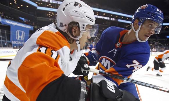 Philadelphia Flyers&#039; Travis Konecny (11) battles with New York Islanders&#039; Luca Sbisa in the third period of a preseason NHL hockey game on Tuesday, Sept. 18, 2018, in New York. (AP Photo/Ada ...