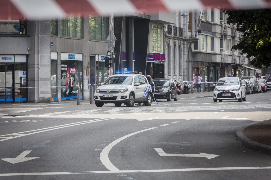 epa06770676 Police cars at the scene following a shooting in Liege, Belgium, 29 May 2018. According to media reports, a gunman was shot dead by anti-terrorist police after reportedly killing two polic ...