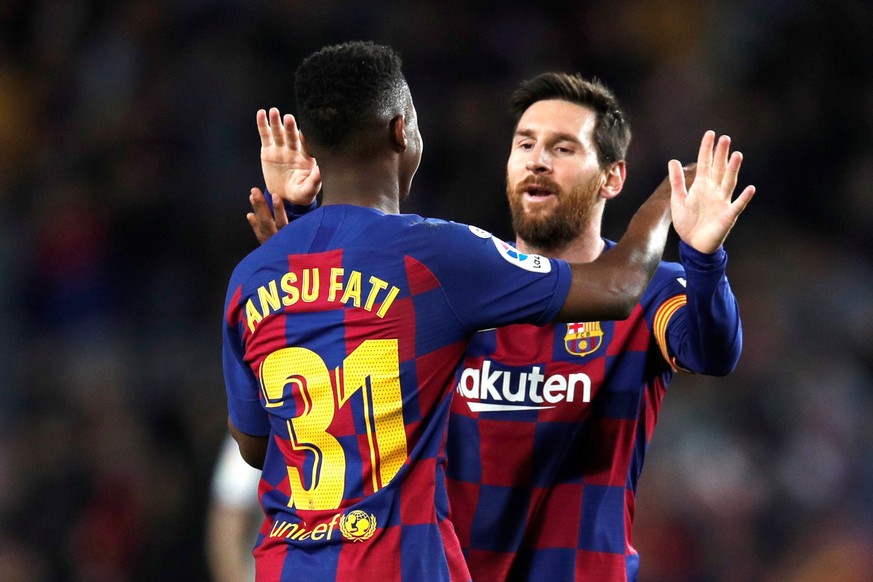 epa08188937 FC Barcelona&#039;s Ansu Fati (front) celebrates with teammate Lionel Messi after scoring during the Spanish LaLiga soccer match between FC Barcelona and UD Levante played at the Camp Nou  ...