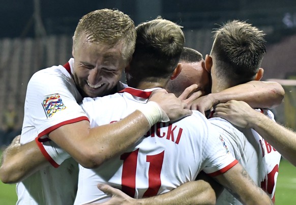 Poland&#039;s Kamil Grosicki, front, celebrates with teammates after scoring his side&#039;s second goal during the UEFA Nations League soccer match between Bosnia-Herzegovina and Poland at the Bilino ...