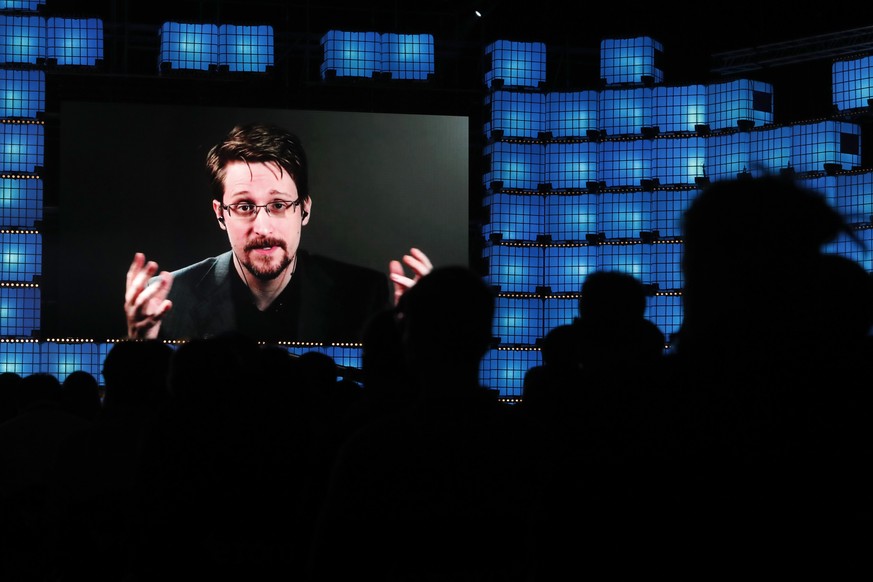 Former U.S. National Security Agency contractor Edward Snowden addresses attendees through video link at the Web Summit technology conference in Lisbon, Monday, Nov. 4, 2019. Snowden has been living i ...