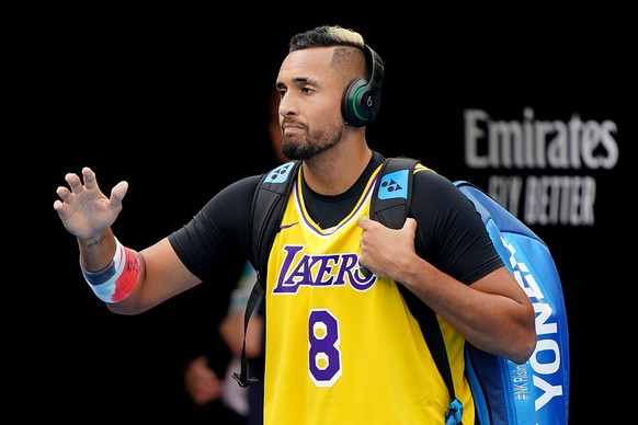 epa08169406 Nick Kyrgios of Australia arrives on court wearing the jersey of late former Los Angeles Lakers player Kobe Bryant, ahead of his fourth round match against Rafael Nadal of Spain at the Aus ...