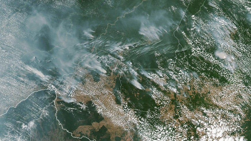 epa07783333 A handout photo made available by NASA of a satellite image showing several fires burning in the Brazilian states of Amazonas (top C-L), Para (top R), Mato Grosso (bottom R) and Rondonia ( ...
