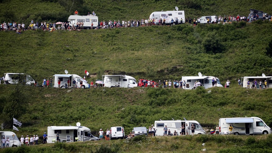 Camping cars of spectators are parked along the road of the Tourmalet pass during the fourteenth stage of the Tour de France cycling race over 117.5 kilometers (73 miles) with start in Tarbes and fini ...