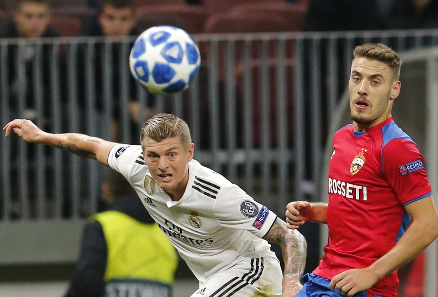 Real midfielder Toni Kroos, left, challenge for the ball with CSKA midfielder Nikola Vlasic during a Group G Champions League soccer match between CSKA Moscow and Real Madrid at the Luzhniki Stadium i ...