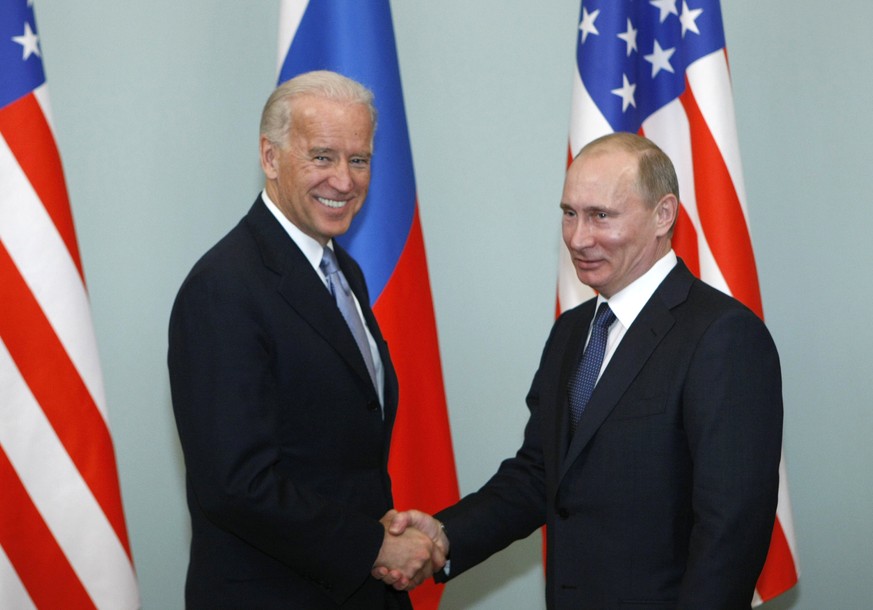 FILE - In this March 10, 2011, file photo, then-Vice President Joe Biden, left, shakes hands with Russian Prime Minister Vladimir Putin in Moscow, Russia. President Joe Biden has been thrown into a hi ...