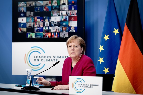 epa09152500 German Chancellor Angela Merkel attends the virtual International Climate Summit with US President Joe Biden (not pictured), in Berlin, Germant, 22 April 2021. The meeting is intended to u ...