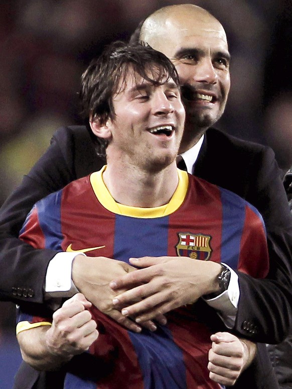 epa08629211 (FILE) A file picture dated 03 May 2011 shows FC Barcelona&#039;s head coach Josep Guardiola embracing Argentinian striker Lionel Messi (front) after the UEFA Champions League semi final s ...