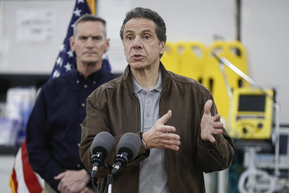 New York Gov. Andrew Cuomo speaks during a news conference alongside the National Guard at the Jacob Javits Center that will house a temporary hospital in response to the COVID-19 outbreak, Monday, Ma ...
