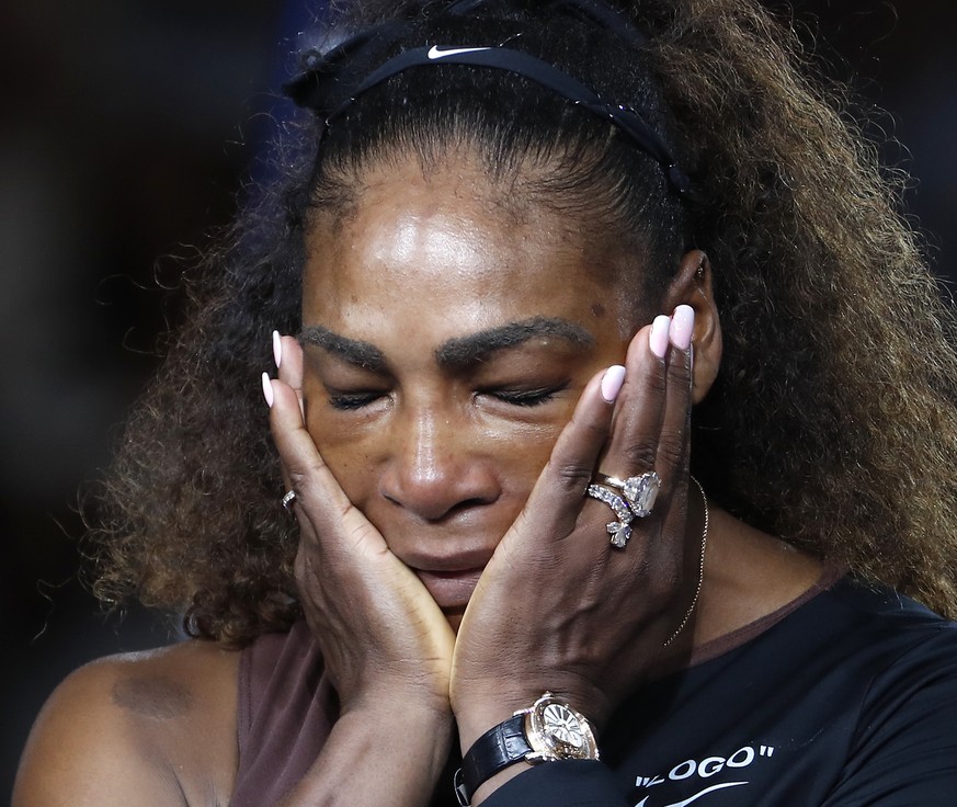 Serena Williams reacts during the trophy ceremony in the women&#039;s final of the U.S. Open tennis tournament, Saturday, Sept. 8, 2018, in New York. Naomi Osaka, of Japan, defeated Williams. (AP Phot ...