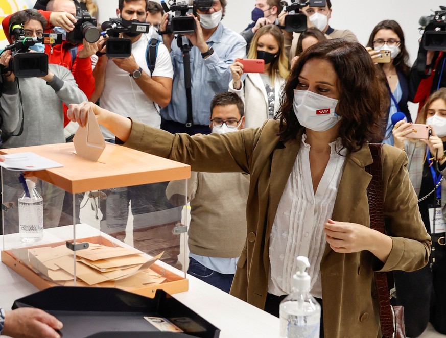 epa09176727 Isabel Diaz Ayuso, Madrid&#039;s Regional President and People&#039;s Party candidate for re-election, casts her ballot for Madrid&#039;s regional election at a polling station in downtown ...