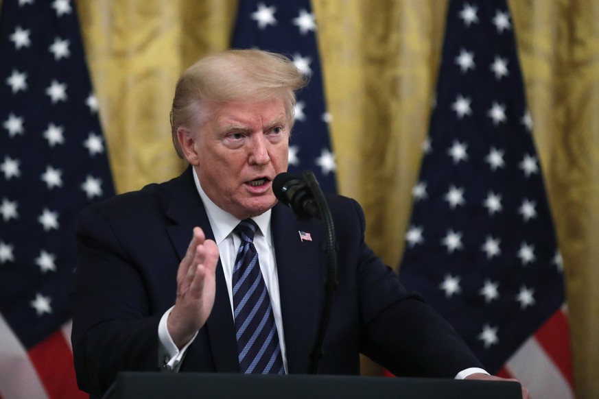 President Donald Trump answers questions from reporters during a event about protecting seniors, in the East Room of the White House, Thursday, April 30, 2020, in Washington. (AP Photo/Alex Brandon)
D ...