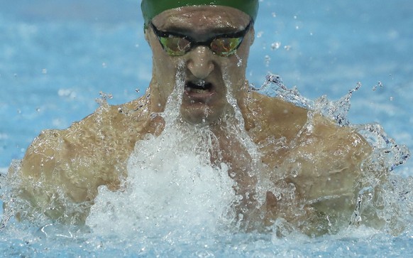 South Africa&#039;s Cameron Van Der Burgh competes on his way to winning gold at the men&#039;s 50 breaststroke during the 14th FINA World Swimming Championships in Hangzhou in eastern China&#039;s Zh ...