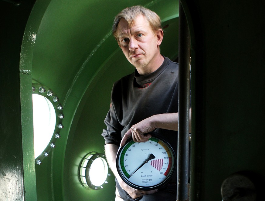 FILE - In this April 30, 2008 file photo, submarine owner Peter Madsen stands inside the vessel. One of the most talked-about and macabre court cases in recent Danish history is set to conclude Wednes ...