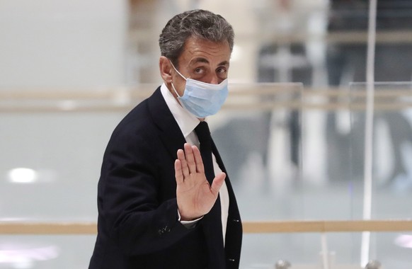 epa08837361 Former French president Nicolas Sarkozy leaves the courtroom during his trial on corruption charges in the so-called &#039;wiretapping affair&#039; in Paris, France, 23 November 2020. The  ...