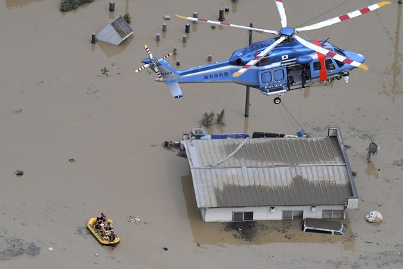 Rescue operation is conducted in a flooded area following a heavy rain in Hitoyoshi, Kumamoto prefecture, southern Japan Saturday, July 4, 2020. Heavy rain in southern Japan triggered flooding and mud ...