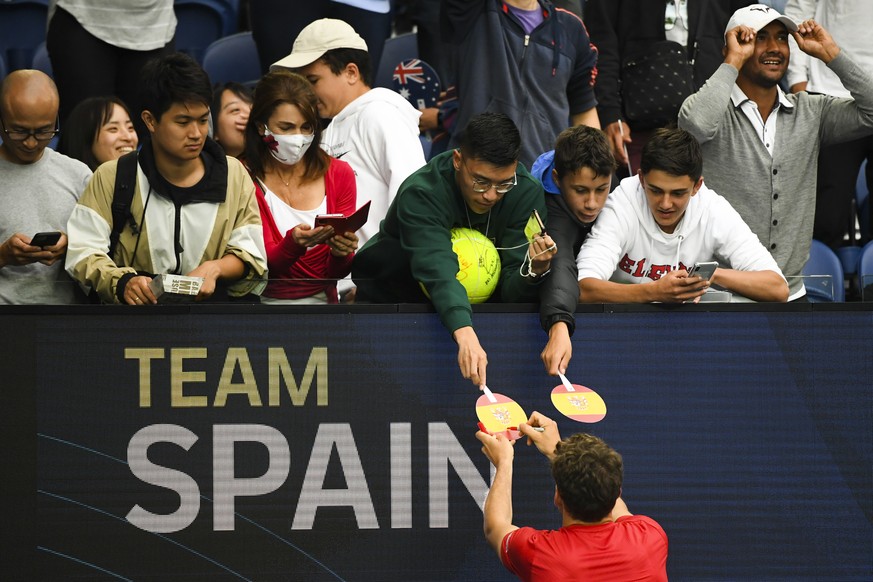epa08980939 Pablo Carreno Busta of Spain interacts with fans after winning the Round 1 of the ATP Cup against John Millman of Australia at Melbourne Park in Melbourne, Australia, 02 February 2021. EPA ...