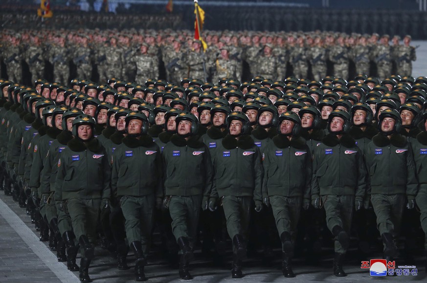 In this photo provided by the North Korean government, North Korean soldiers march in formation during a military parade marking the ruling party congress, at Kim Il Sung Square in Pyongyang, North Ko ...