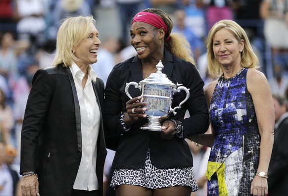 Martina Navratilova, left, and Chris Evert, right, pose for a photo with Serena Williams after Williams defeated Caroline Wozniacki, of Denmark, in the championship match of the 2014 U.S. Open tennis  ...