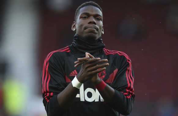 Manchester United&#039;s Paul Pogba applauds the fans as he takes part in the warm up prior to the start of the English Premier League soccer match between Manchester United and Leicester City at Old  ...