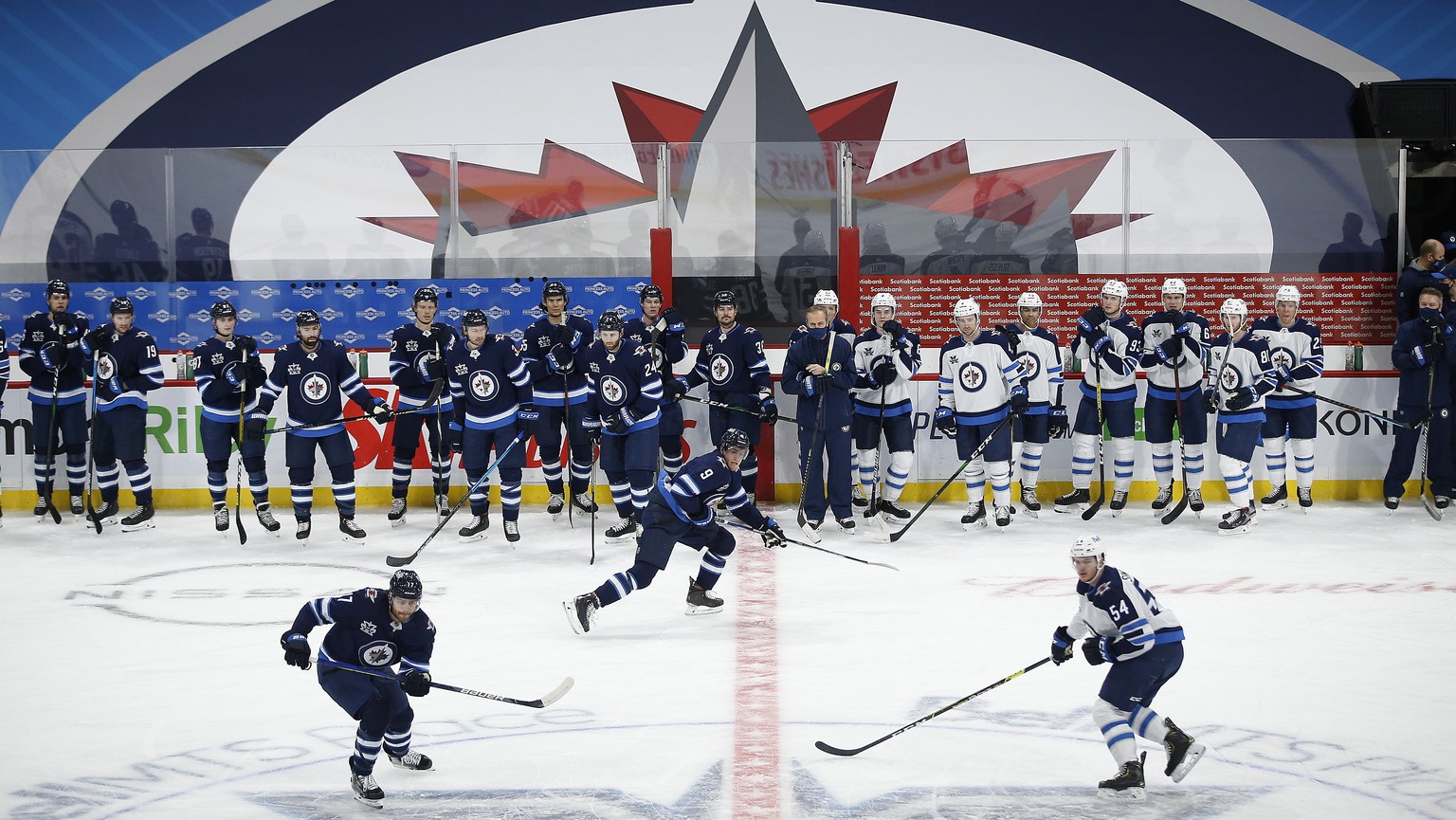 The Winnipeg Jets run drills during NHL training camp in Winnipeg, Manitoba, Monday, Jan. 11, 2021. (John Woods/The Canadian Press via AP)