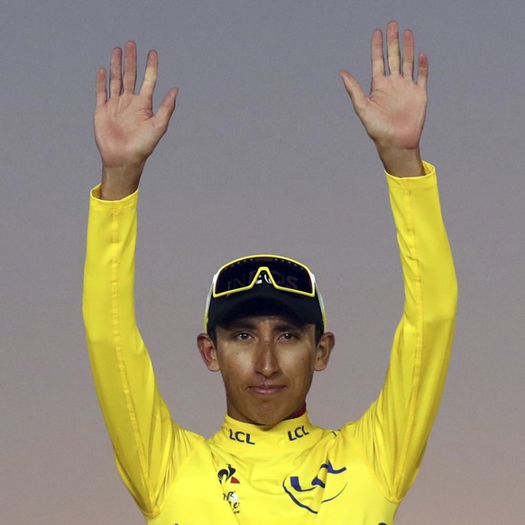 Colombia&#039;s Egan Bernal, the winner, center, Britain&#039;s Geraint Thomas, who placed second, left, and the Netherlands&#039; Steven Kruijswijk, third, stand on the podium of the Tour de France c ...