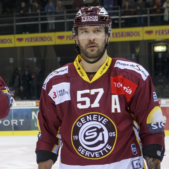 Geneve-Servette&#039;s players defender Tim Grossniklaus, let, forward Jeremy Wick, 2nd left, forward Juraj Simek, 2nd right, and defender Goran Bezina, right, look disappointed after losing against B ...