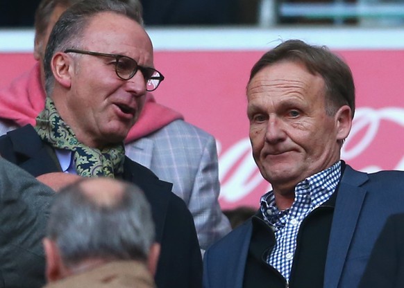 MUNICH, GERMANY - APRIL 12: Karl-Heinz Rummenigge (L) CEO of Bayern Muenchen talks to Hans-Joachim Watzke, CEO of Dortmund prior to the Bundesliga match between FC Bayern Muenchen and BVB Borussia Dor ...