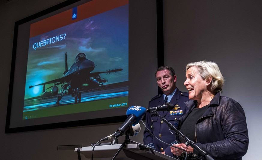 epa07971738 Dutch Defense Minister Ank Bijleveld (R) and Colonel aviator Peter Tankink during a press conference in The Hague, The Netherlands, 04 November 2019, about an attack by a Dutch F-16 on an  ...