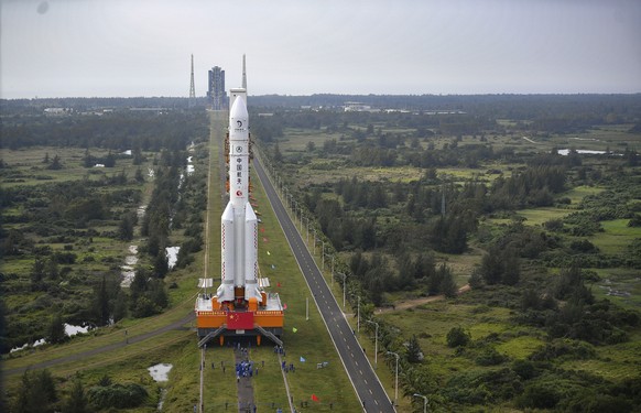In this Nov. 17, 2020, photo released by China&#039;s Xinhua News Agency, a Long March-5 rocket is moved at the Wenchang Space Launch Site in Wenchang in southern China&#039;s Hainan Province. Chinese ...