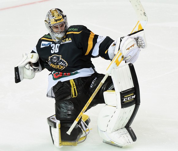 Lugano&#039;s goalie Elvis Merzlikins celebrates his team&#039;s victory after the preliminary round game of National League A (NLA) Swiss Championship 2014/15 between HC Lugano and Geneva Servette HC ...