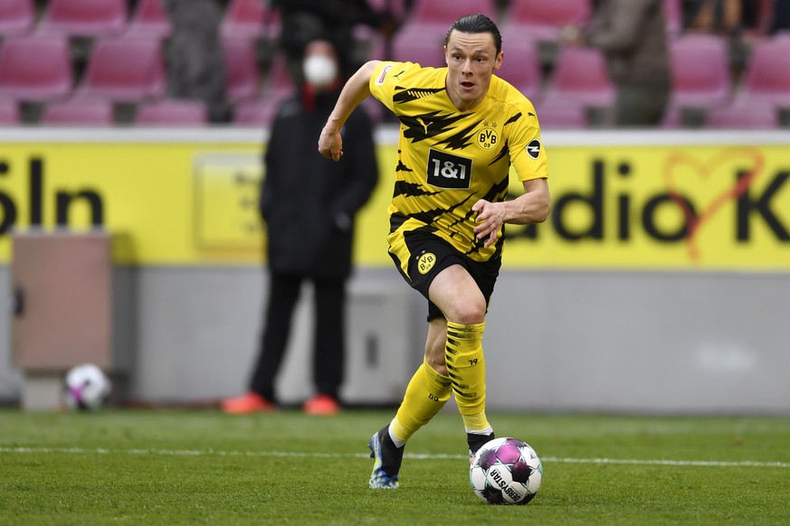 Dortmund&#039;s Nico Schulz in action during the German Bundesliga soccer match between Cologne and Dortmund at the RheinEnergieStadion stadium in Cologne, Germany, Saturday, March 20, 2021. (Marius B ...