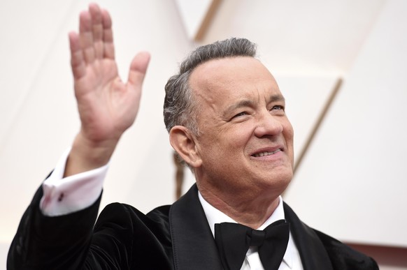 FILE - In this Sunday, Feb. 9, 2020 file photo, Tom Hanks arrives at the Oscars at the Dolby Theatre in Los Angeles. On Friday, May 15, 2020, The Associated Press reported on videos circulating online ...