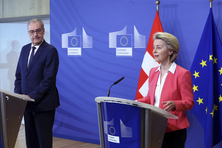 European Commission President Ursula Von der Leyen, right, and Swiss President Guy Parmelin participate in a media conference at EU headquarters in Brussels, Friday, April 23, 2021. (Francois Walschae ...