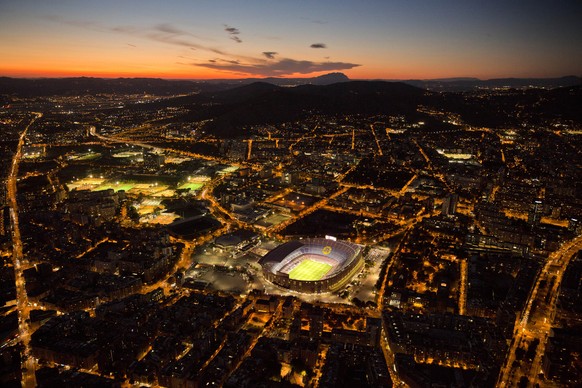 The Camp Nou stadium is illuminated ahead of a soccer match between Barcelona F.C and Eibar in Barcelona, Spain, Tuesday, Sept. 19, 2017. (AP Photo/Emilio Morenatti)