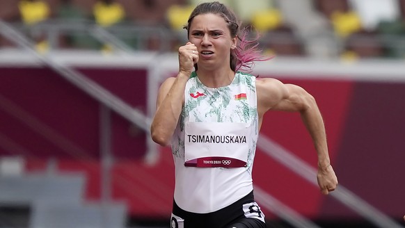 Krystsina Tsimanouskaya, of Belarus, runs in the women&#039;s 100-meter run at the 2020 Summer Olympics, Friday, July 30, 2021. Tsimanouskaya alleged her Olympic team tried to remove her from Japan in ...