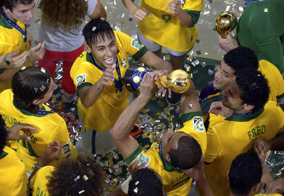 The photo provided by FIFA shows Brazil&#039;s Neymar celebrating with his teammates after winning the Confederations Cup final between Brazil and Spain at Maracana stadium in Rio de Janeiro, Brazil,  ...
