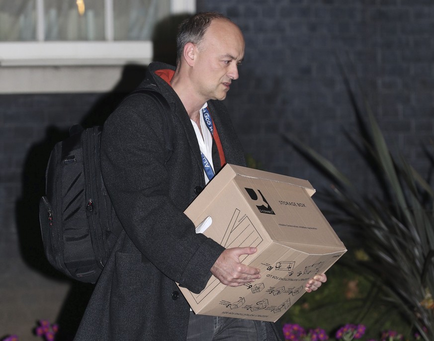 Britain&#039;s Prime Minister Boris Johnson&#039;s top aide Dominic Cummings leaves 10 Downing Street with a box, in London, Friday, Nov. 13, 2020. Late Wednesday, Lee Cain announced he was quitting a ...