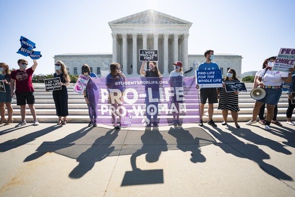 epaselect epa08516054 Anti-abortion protesters gather outside the Supreme Court of the United States as its nine justices prepare to rule on the final cases of the year in Washington, DC, USA, 29 June ...