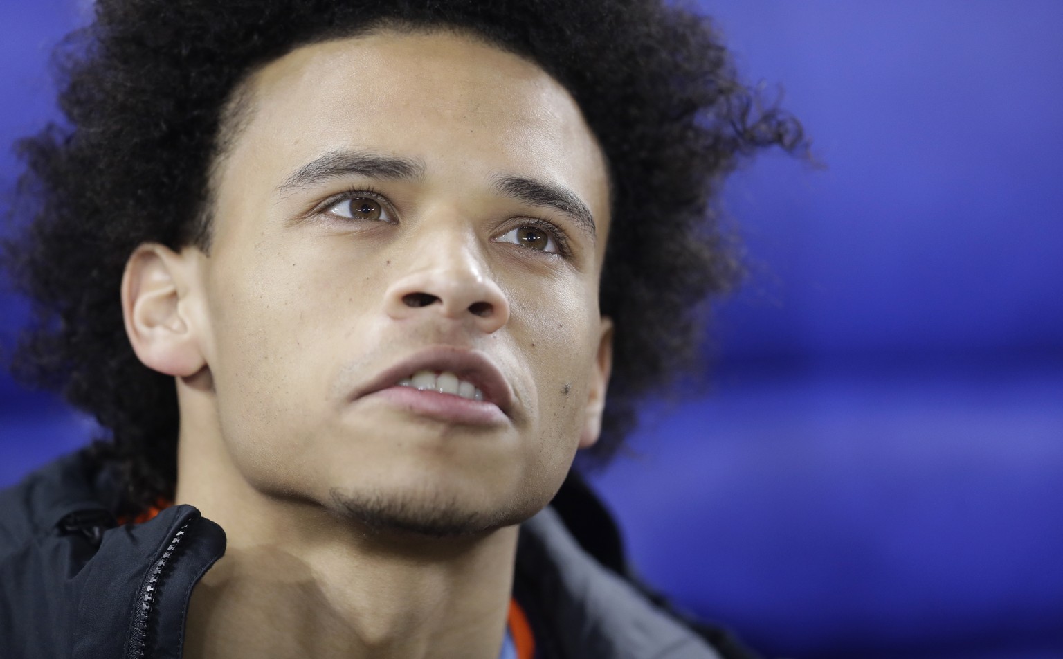 Manchester&#039;s Leroy Sane takes his seat on the substitutes bench prior to the first leg, round of sixteen, Champions League soccer match between Schalke 04 and Manchester City at Veltins Arena in  ...