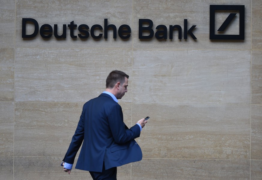 epa06483653 (FILE) - A man walks past by the British headquarters of the German Deutsche Bank in London, Britain, 30 September 2016 (re-issued on 29 January 2018). German Frankfurter Allgemeine Sonnta ...