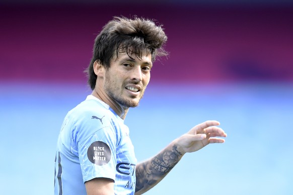 Manchester City&#039;s David Silva walks on the pitch during the English Premier League soccer match between Manchester City and Norwich City at the Etihad Stadium in Manchester, England, Sunday, July ...