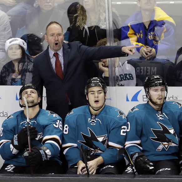 San Jose Sharks coach Peter DeBoer, top, argues a call during the first period of the team&#039;s NHL hockey game against the Edmonton Oilers on Friday, Dec. 23, 2016, in San Jose, Calif. (AP Photo/Ma ...