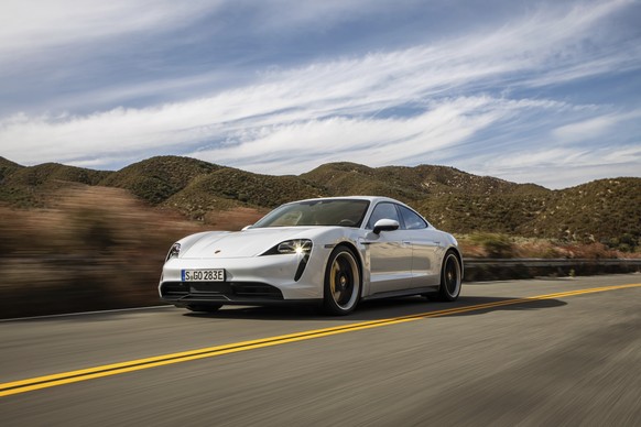 This photo provided by Porsche shows the 2020 Porsche Taycan, a premium electric sedan with an estimated range of 227 miles. Edmunds has noted that this car is capable of getting more range in real-wo ...