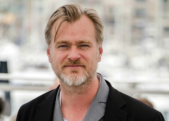 FILE - In this May 12, 2018, file photo, director Christopher Nolan poses during a photo call at the 71st international film festival in Cannes, southern France. Warner Bros. will release Nolan���s �� ...