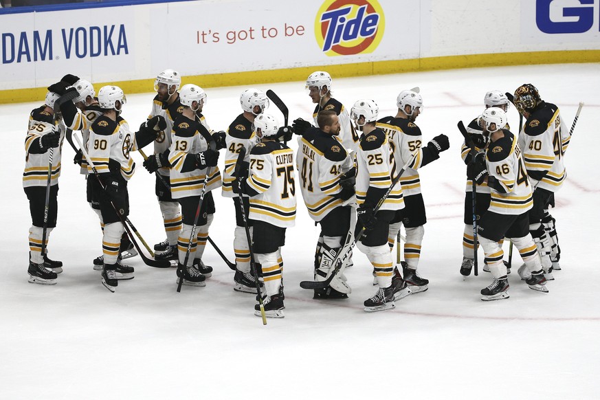 Boston Bruins players celebrate as they leave the ice after beating the St. Louis Blues in Game 3 of the NHL hockey Stanley Cup Final Saturday, June 1, 2019, in St. Louis. The Bruins won 7-2 and lead  ...