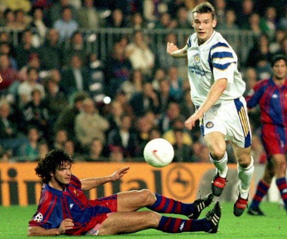 Dynamo kiev&#039;s striker Andrei Shevchenko, who scored a hat-trick, passes the ball away from Barcelona&#039;s Portuguese defender Fernando Couto during an European Champions League match in Barcelo ...