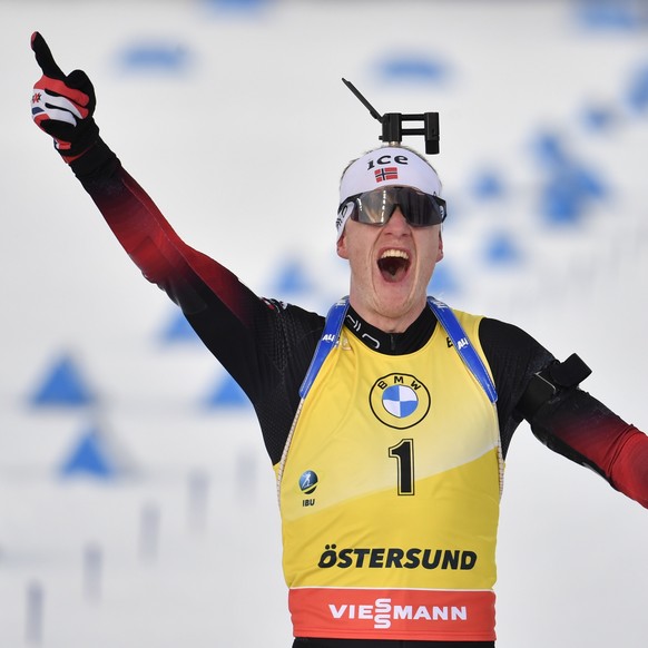 epa09088423 Third placed Johannes Thingnes Boe of Norway celebrates while crossing the finish line during the Men&#039;s 15km Mass Start Competition at the IBU World Cup Biathlon event in Ostersund, S ...