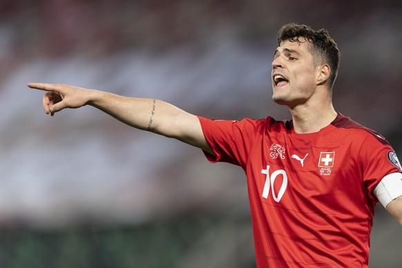 Switzerland&#039;s Granit Xhaka gestures during the FIFA World Cup Qatar 2022 qualifying Group C soccer match between Switzerland and Lithuania, at the Kybunpark Stadium in St. Gallen, Switzerland, Su ...
